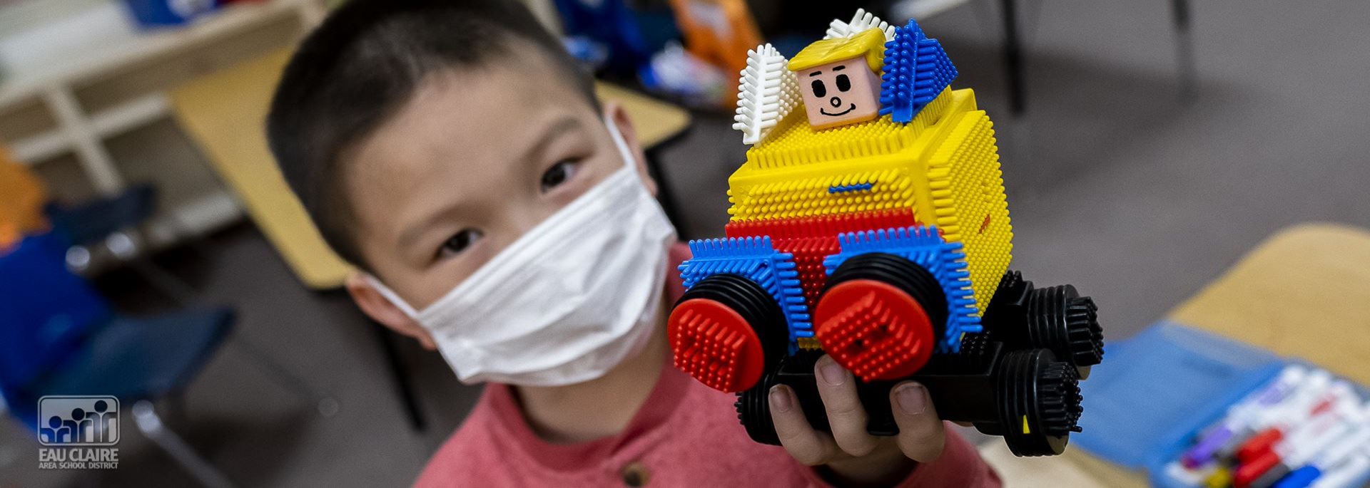 student with lego creation 